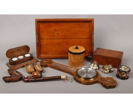 A group of collectable wooden items including an Edwardian oak butlers tray, oak three inkwell desk stand, maple and ebony te