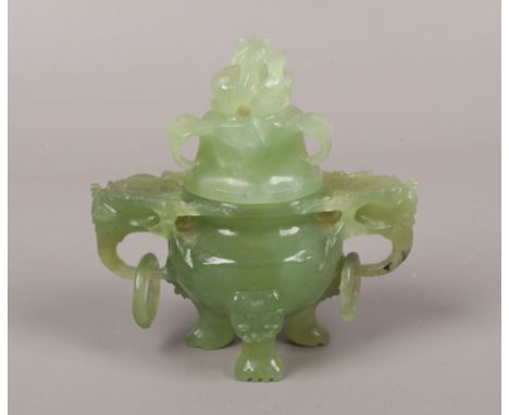 A Chinese 20th century miniature jade censer and cover. Carved with mythical beasts and separated loop handles,&nbsp;8.75cm.C