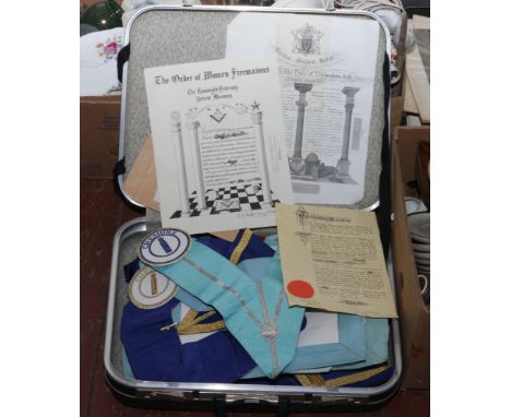 A case of Masonic regalia to include ephemera, sash, badges, bags etc.