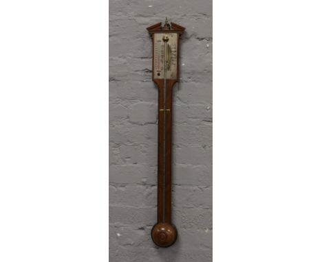 A 20th century Georgian style mahogany stick barometer with silvered dial and adjuster. Having mercury tube and alcohol therm