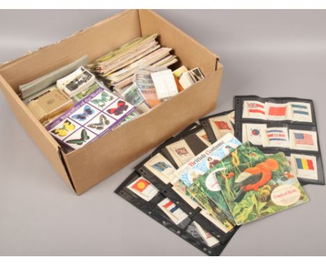 A box of tea and cigarette collectors cards including Brooke Bond tea, Kensitas silks, Wills, Senior service, John Player &am