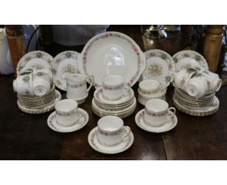 A Royal Stafford bone china 12 place tea service in the True Love design, along with a Paragon part set in the Belinda design