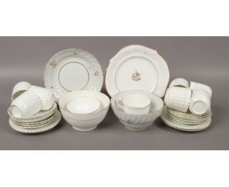 A quantity of 19th century bone china teawares with gilded decoration including slop bowls, cups and saucers, sandwich plate 