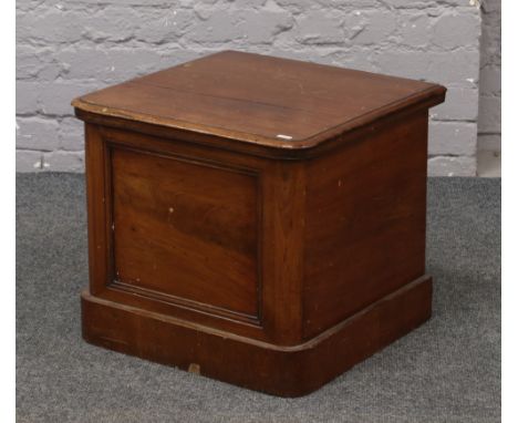 A 19th century mahogany commode with liner.