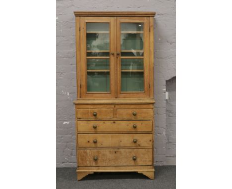 A Victorian pine bookcase over drawer base fitted with three internal drawers, raised on bracket feet, W 89cm x H 186cm.Condi