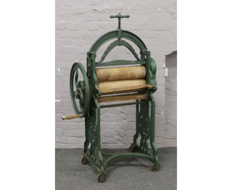 A green painted Victorian cast iron mangle marked New Crown Diamond trade mark by J. R. Sharp &amp; Son Hull.