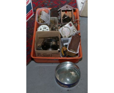 A box of clock parts including movements, part cuckoo clock, glasses etc along with various horologists tools, de-magnetizing