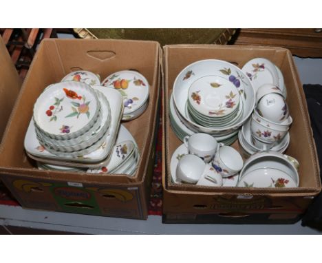 A large Royal Worcester dinner service in the Evesham and Evesham Vale designs including tureens, plates, cups and saucers, b