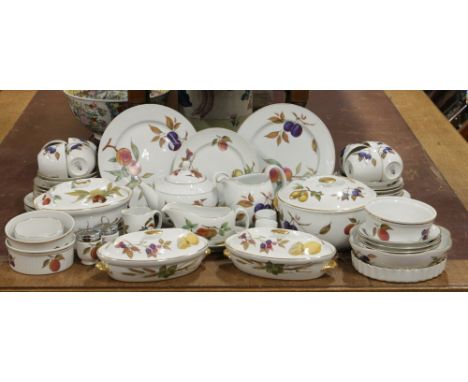 A large quantity of Royal Worcester 'Evesham' tea and dinnerwares including cups and saucers, sauce boat, tureens, plates, eg