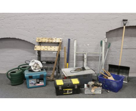A collection of tools to include folding Workmate, Power Performance table saw, Makita 190mm circular saw, angle grinder, var