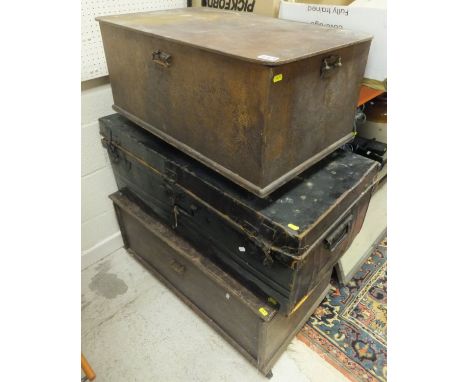 Two wooden trunks and a metal trunk