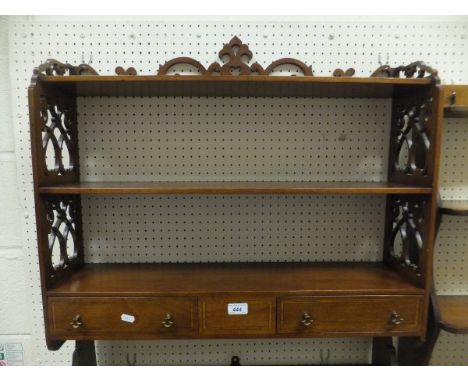 A mahogany and inlaid three tier wall shelf unit with two drawers in the Sheraton revival taste CONDITION REPORTS Light gener