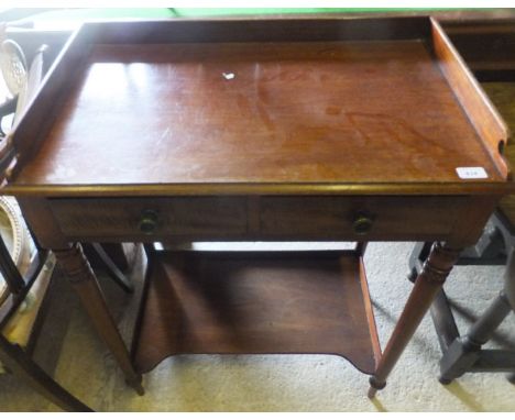 A Victorian mahogany washstand, the three quarter galleried top above two drawers on turned legs united by a pot shelf