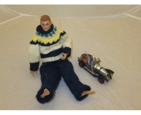 A Corgi Toys "Chitty Chitty Bang Bang" car, together with an Action Man figure in knitted woollen outfit