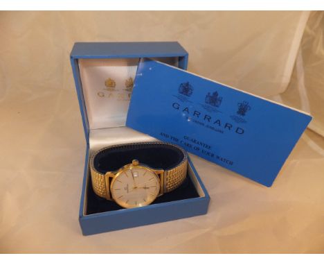 A Garrard wristwatch, the brushed dial set with Roman numeral markers and date marker inscribed verso "Cornwell Parker 25 Clu