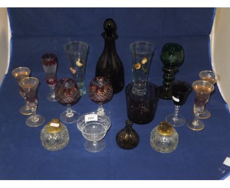 An amethyst coloured glass decanter inscribed "Thos Webb", a green glass goblet with etched grape on vine decoration, and var
