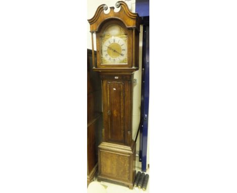 A 19th Century oak cased long case clock with later musical movement and brassed arched dial, with silvered chapter ring, Ara