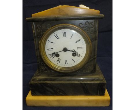 A black marble cased mantel clock with cream marble pediment and base with Roman numerals to the dial