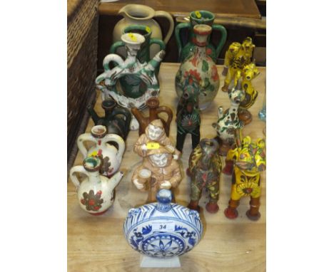 A collection of Peruvian style pottery ornaments, to include animals, vases, jugs, etc, together with a further pottery jug a