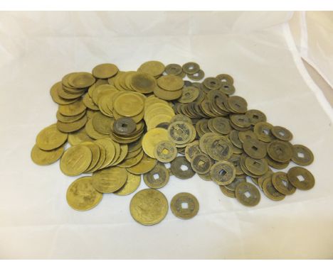 A collection of 19th Century Chinese bronze or brass coinage, and a collection of brass gaming tokens with George & The Drago