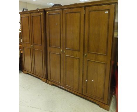 A Younger Furniture bedroom suite comprising triple wardrobe, double wardrobe, dressing chest, chest and mirror, together wit