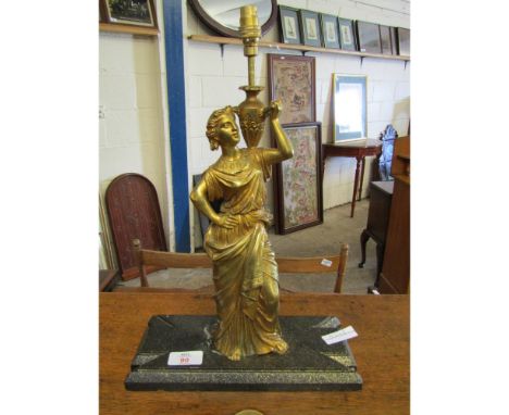 GILT METAL FIGURE FORMED LAMP LACKING SHADE ON A SLATE BASE 