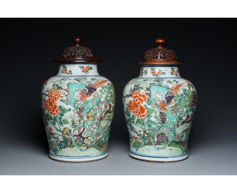 Full title: A pair of Chinese famille verte 'pheasant' vases with wooden covers, KangxiDescription:H.: 40 cm (incl. wooden co