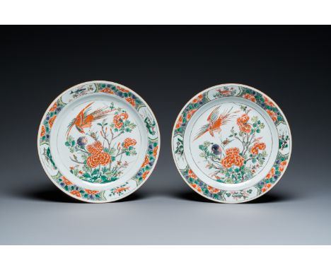 Full title: A pair of Chinese famille verte plates with a bird above a peony bush, KangxiDescription:Dia.: 24 cm