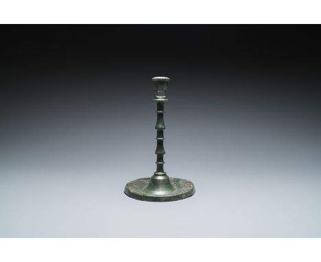 Full title: A Dutch or Flemish knotted bronze candlestick, 15th C.Description:H.: 22,5 cm  Provenance:- The collection of Mr.