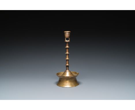Full title: A Dutch or Flemish knotted bronze candlestick, 15/16th C.Description:H.: 23,5 cm  Provenance:- The collection of 