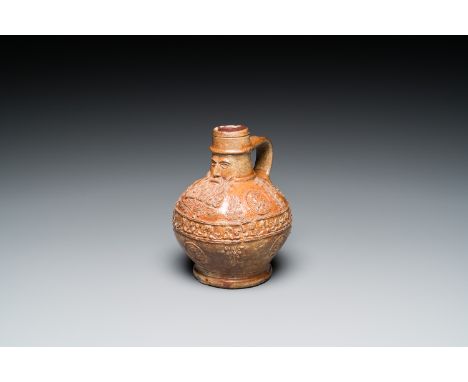 Full title: A small stoneware bellarmine jug with portrait medallions, Cologne, 16th C.Description:H.: 14 cm