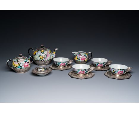 Full title: A Chinese eight-piece silver-mounted famille rose millefleurs tea service, Qianlong mark 20th C.Description:H.: 1