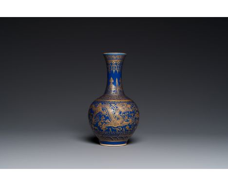 Full title: A Chinese monochrome blue gilt-decorated 'dragons' bottle vase, Qianlong mark, 19th C.Description:H.: 22 cm