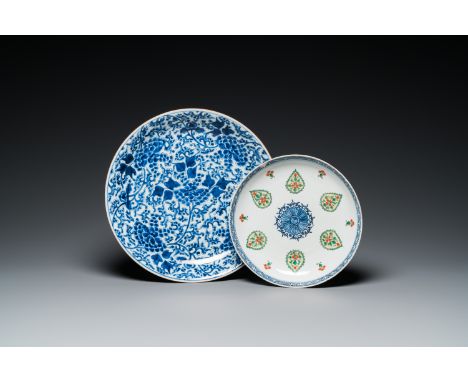 Full title: A Chinese blue and white 'peony scroll' dish and a famille verte dish, KangxiDescription:Dia.: 36 - 26,5 cm