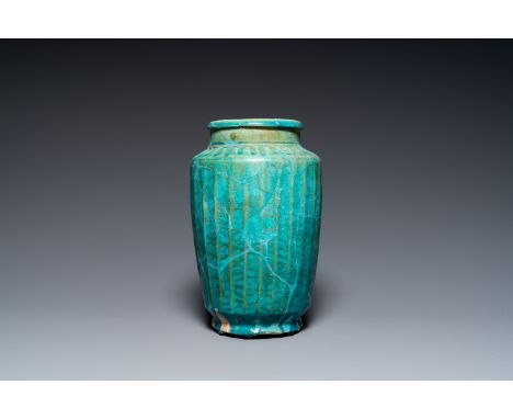 Full title: A turquoise-glazed Kashan albarello, Persia, 13th C.Description:H.: 28 cm