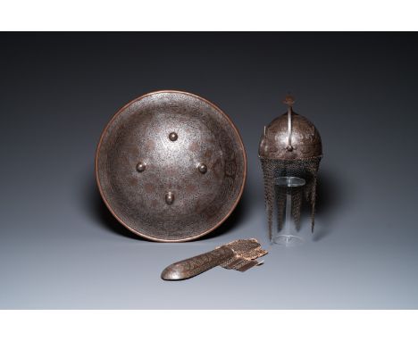 Full title: A Qajar tinned copper helmet (khula khud), shield (dhal) and arm piece (dastana), Persia, 19th C.Description:Dia.