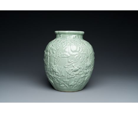 Full title: A Chinese relief-molded monochrome celadon-glazed vase, 19/20th C.Description:H.: 24,5 cm