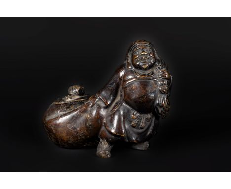 Japanese Art An antropomorphic bronze inkwell in the shape of a Lohan dragging the budleJapan, late 19th century . . Cm 18,00