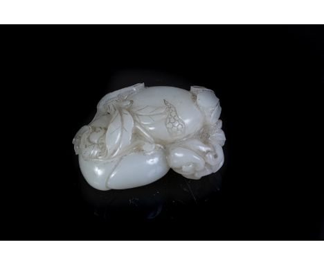 Chinese Art A white jade carving depicting fruitsChina, 19th century . . Cm 6,00 x 4,00.