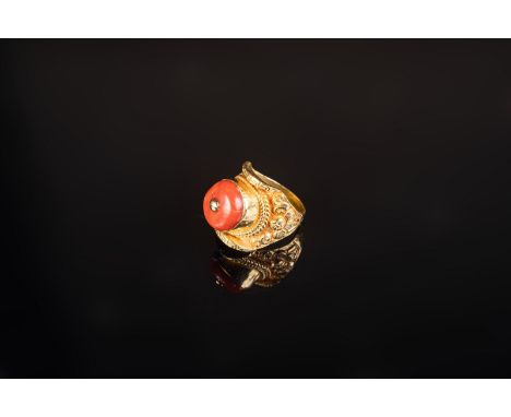 Himalayan Art A sadle shaped gold ring encrusted with coral Tibet, 20th century . . Cm 2,80.
