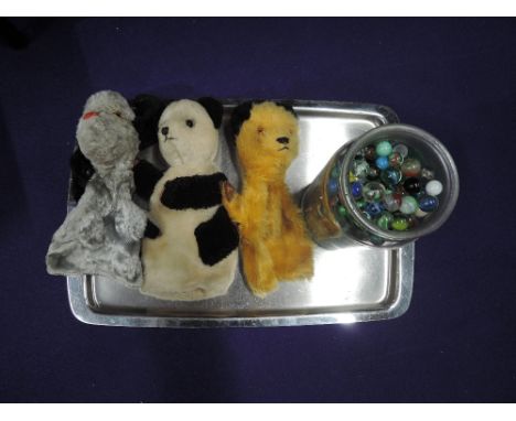 A jar of approx 300 mixed vintage marbles and three vintage glove puppets, Sooty, Sweep and Sue