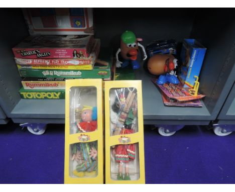 A shelf of modern toys including two Pelham Puppets, Gypsy &amp; Clown, both boxed, Totopoly, Rummikub etc