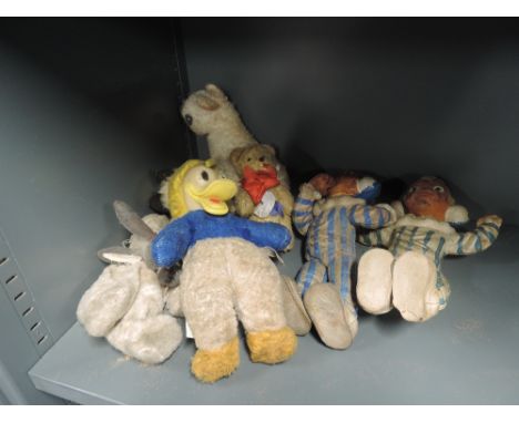 Eight vintage soft toys including Semco Walt Disney Donald Duck having rubber face, Bendy Andy Andy etc