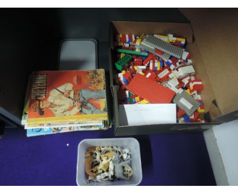 A selection of vintage Lego pieces, a selection of Britains and similar plastic animals and accessories along with a selectio