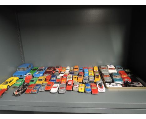 A shelf of playworn diecasts including Corgi, Matchbox etc