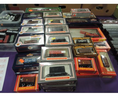 A collection of Bachmann, Dapol, Hornby and similar 00 gauge carriages and wagons, 50 in total, all boxed