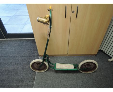 A vintage Triang scooter in green with white tyres having original stand, later horn fitted