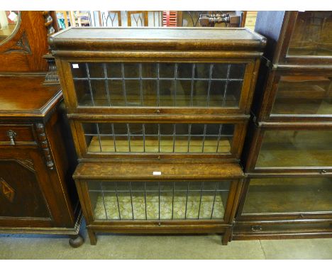 A Globe Wernicke oak three tier sectional bookcase