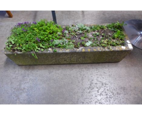 A concrete garden trough