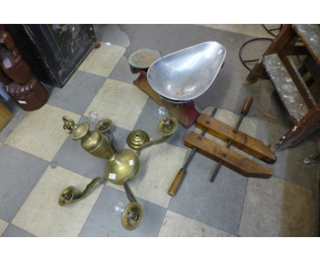A set of shop scales, vintage clamp and brass chandelier
